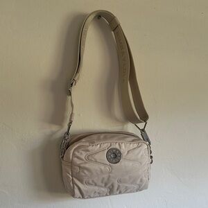 Bimba Y Lola Beige Crossbody Bag with silver accents.